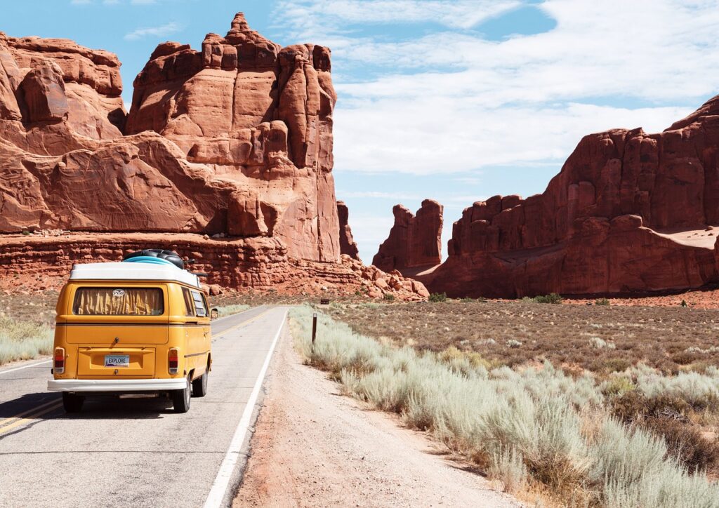 A yellow van conversion on a road trip near Arches National Park (Arizona)