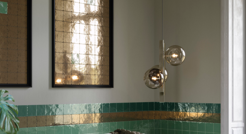 New tile "Terrecotte Oro" featured in two picture frames above a bathroom counter, creating a faux mirror look