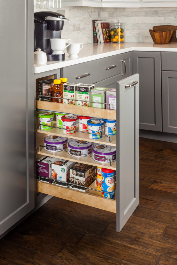 Kitchen storage divided into 4 shelves within one big pull-out drawer, with shelves installed directly onto a cabinet face