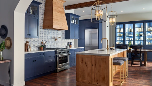 Blue and natural wood kitchen from Ultracraft, featuring blue cabinets and shelving