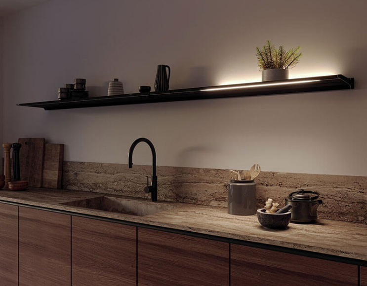 Novy Shelf Pro lighting up the righthand side of a full long, floating Shelf Pro above a kitchen counter